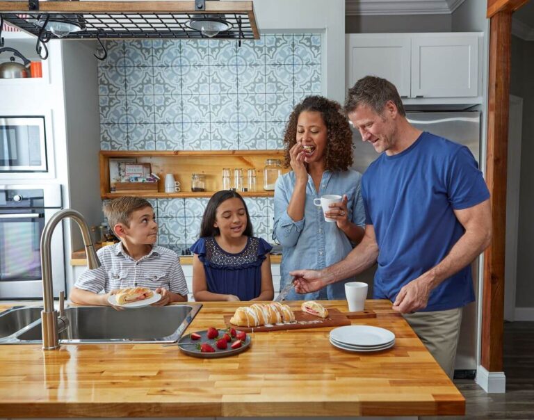 Family in a kitchen eating a Butter Braid Pastry